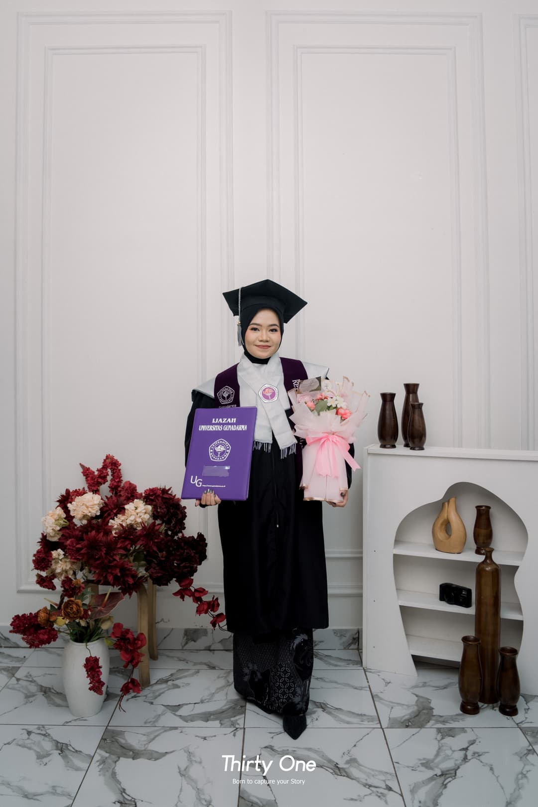 Graceful graduation studio moment